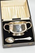 A CASED GEORGE VI SILVER TWIN HANDLED PORRIDGE BOWL AND TREFID SPOON, the bowl stamped 37561 to