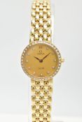 AN 18CT GOLD 1990'S DIAMOND SET QUARTZ OMEGA DE VILLE WRISTWATCH, champagne dial with diamond dot