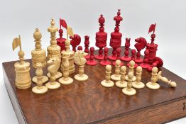 A MID 19TH CENTURY BARLEYCORN PATTERN CARVED BONE CHESS SET STAINED RED AND NATURAL, comprising