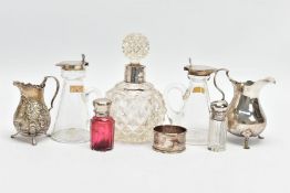 A PARCEL OF SILVER AND SILVER MOUNTED GLASSWARE, comprising two silver topped clear glass whisky