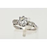 A MID TO LATE TWENTIETH CENTURY THREE STONE DIAMOND RING, principle round brilliant cut diamond claw