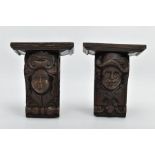 A PAIR OF 17TH CENTURY AND LATER OAK CORBELS, carved with the masks of a cavalier style gentleman