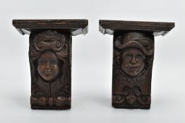 A PAIR OF 17TH CENTURY AND LATER OAK CORBELS, carved with the masks of a cavalier style gentleman