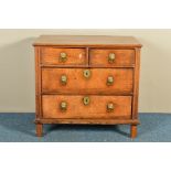 AN 18TH CENTURY AND POSSIBLY LATER OAK CHEST OF TWO SHORT OVER TWO LONG DRAWERS, with brass lion