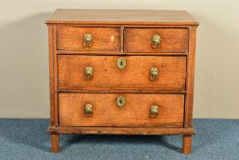 AN 18TH CENTURY AND POSSIBLY LATER OAK CHEST OF TWO SHORT OVER TWO LONG DRAWERS, with brass lion