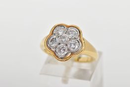 A MODERN DIAMOND CLUSTER RING, seven round brilliant cut diamonds, rim and grain set in a floral