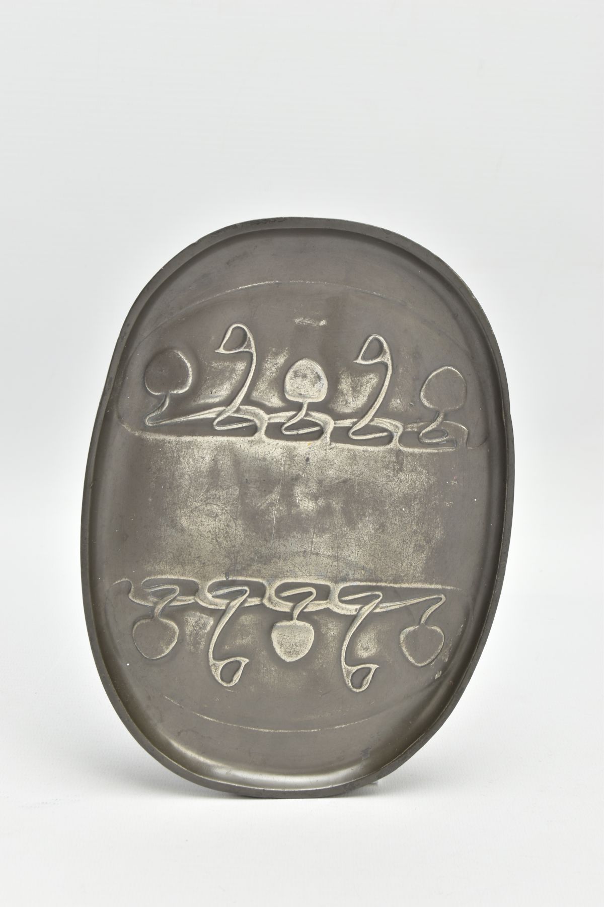 A TUDRIC PEWTER OVAL DISH, cast with a sinuous scrolling design, stamped 'Tudric 0164' to the
