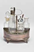 A GEORGE III SILVER SIX BOTTLE CRUET STAND OF OVAL FORM, centre handle on a plain cylindrical stem