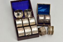 A CASED PAIR OF EDWARDIAN SILVER CIRCULAR NAPKIN RINGS, pierced decoration, maker J.S, Birmingham