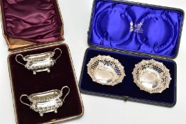 A CASED PAIR OF LATE VICTORIAN BONBON DISHES OF CIRCULAR FORM, repousse decorated and pierced with