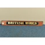 A LATE VICTORIAN WALNUT FRAMED REVERSE PAINTED ON GLASS 'BRITISH WINES' SIGN, the walnut surround