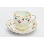 A CHELSEA DERBY PORCELAIN FLUTED COFFEE CUP AND SAUCER, CIRCA 1770, painted with garlands of