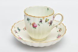 A CHELSEA DERBY PORCELAIN FLUTED COFFEE CUP AND SAUCER, CIRCA 1770, painted with garlands of