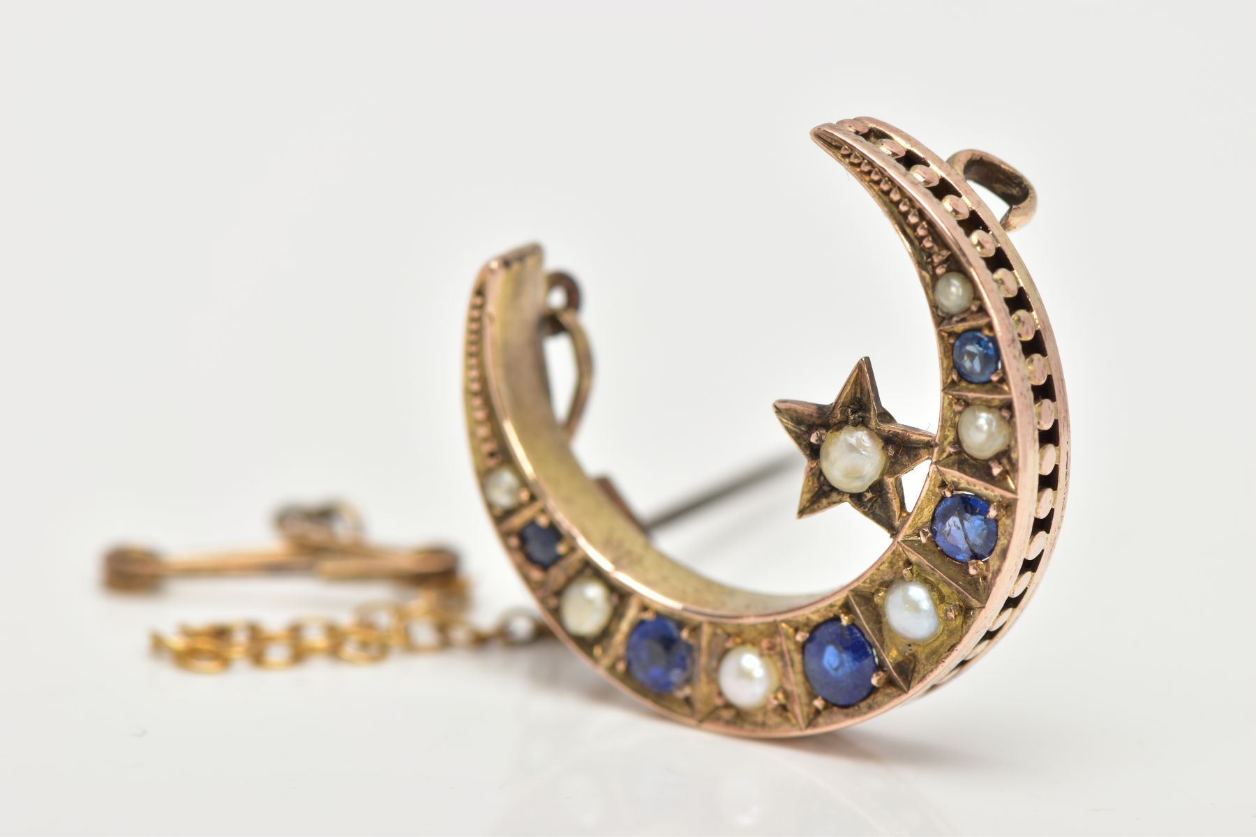 A LATE VICTORIAN 9CT GOLD SAPPHIRE AND SPLIT PEARL CRESCENT BROOCH, designed as circular sapphires - Image 3 of 7