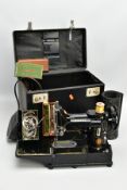 A CASED SINGER MODEL 222K FEATHERWEIGHT PORTABLE SEWING MACHINE, serial number EK324234, bears