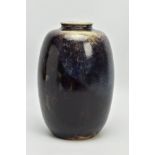 A RUSKIN POTTERY OVOID VASE, decorated with a dark purple flambe glaze, impressed 'RUSKIN ENGLAND