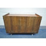 A DANISH 1960'S/70'S ROSEWOOD ROLLING TWO DOOR CABINET, unlabelled, width 91cm x depth 44cm x height