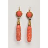 A PAIR OF LATE VICTORIAN CARVED CORAL DROP EARRINGS, each designed as an elongated drop carved