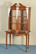 A SHERATON REVIVAL MAHOGANY AND MARQUETRY PAINTED SERPENTINE BOOKCASE ON STAND, decorated with