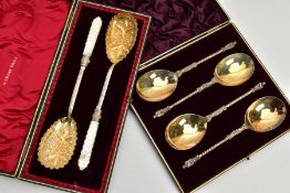 A CASED SET OF FOUR VICTORIAN SILVER APOSTLE TOP SPOONS, the case with gilt presentation