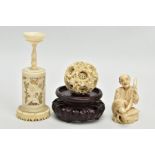 A LATE 19TH CENTURY CHINESE CANTON CARVED IVORY PUZZLE BALL ON STAND AND A JAPANESE MEIJI PERIOD