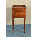 A REGENCY MAHOGANY POT CUPBOARD, the raised back and sides over a panelled single door, on turned