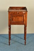 A REGENCY MAHOGANY POT CUPBOARD, the raised back and sides over a panelled single door, on turned