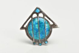 AN ART NOUVEAU SILVER ENAMEL BROOCH BY JAMES FENTON, a stylised arrow and shield decorated with blue