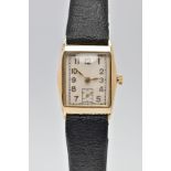 A 9CT GOLD TONNEAU SHAPED HAND-WOUND WRISTWATCH, rectangular silvered dial with Arabic numerals