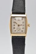 A 9CT GOLD TONNEAU SHAPED HAND-WOUND WRISTWATCH, rectangular silvered dial with Arabic numerals