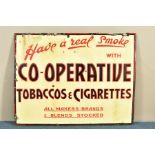 A VINTAGE ENAMEL SIGN 'Have a real smoke WITH CO-OPERATIVE TOBACCOS & CIGARETTES ALL MAKERS BRANDS &