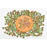 A TREEN CIRCULAR SOLITAIRE BOARD WITH TWENTY NINE VICTORIAN GLASS MARBLES, most with air twist and