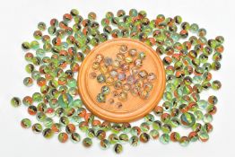 A TREEN CIRCULAR SOLITAIRE BOARD WITH TWENTY NINE VICTORIAN GLASS MARBLES, most with air twist and