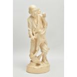 A LARGE JAPANESE MEIJI PERIOD IVORY OKIMONO, of a man standing holding a persimmon in his raised