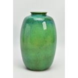 A RUSKIN POTTERY OVOID VASE, decorated with a high fired mottled green and turquoise glaze,