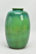 A RUSKIN POTTERY OVOID VASE, decorated with a high fired mottled green and turquoise glaze,