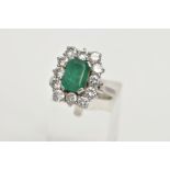 A LATE TWENTIETH CENTURY DIAMOND AND EMERALD CLUSTER RING, a rectangular cluster centring on an