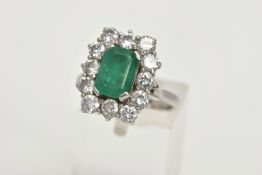 A LATE TWENTIETH CENTURY DIAMOND AND EMERALD CLUSTER RING, a rectangular cluster centring on an
