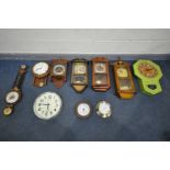 A SELECTION OF WALL CLOCKS of various styles and shapes, along with two circular aneroid barometers,