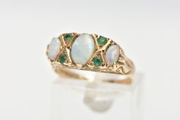 A 9CT GOLD, OPAL AND EMERALD RING, three oval opals set with four small circular cut emeralds, prong