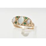 A 9CT GOLD, OPAL AND EMERALD RING, three oval opals set with four small circular cut emeralds, prong