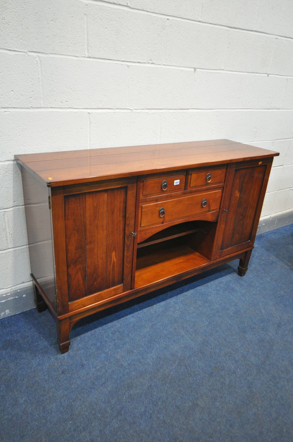 A CHARLES BARR CHERRYWOOD SIDEBOARD, with double cupboard door flanking and arrangement of drawers - Bild 2 aus 3