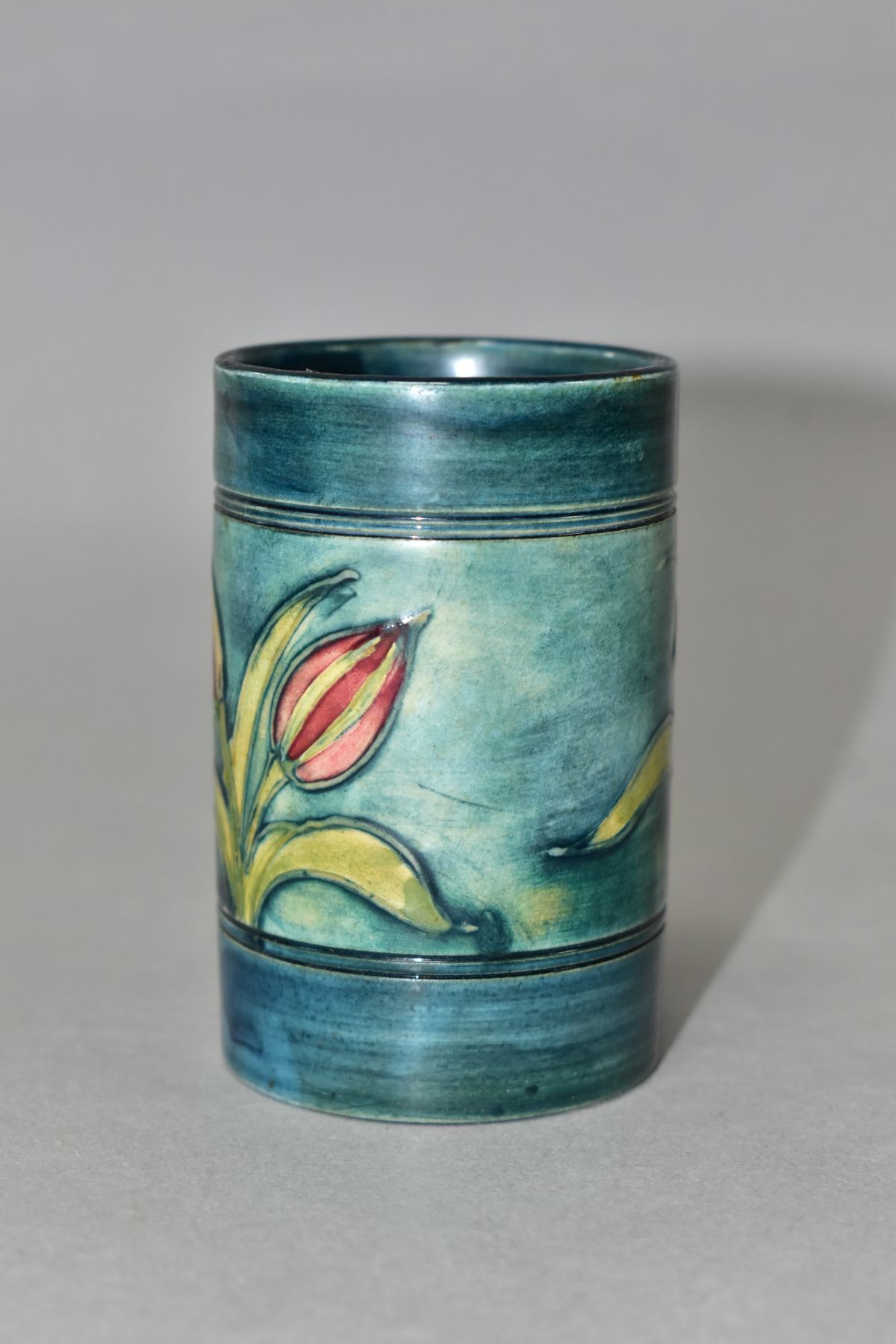 A MOORCROFT POTTERY CYLINDRICAL VASE, banded and decorated with tube lined Freesias on a blue - Image 4 of 6