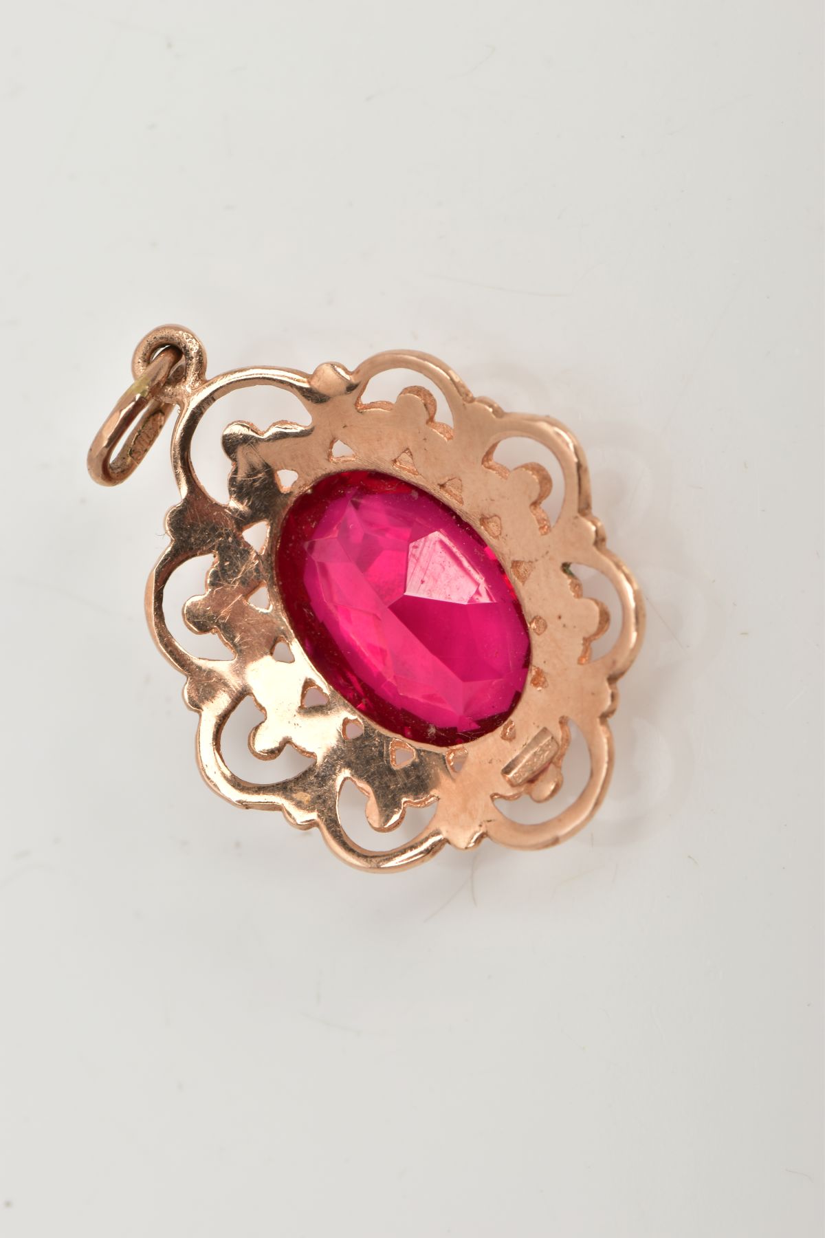A YELLOW METAL SYNTHETIC RUBY PENDANT, designed with a central oval cut synthetic ruby, - Image 4 of 5
