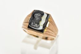 A GENTS 9CT GOLD CAMEO SIGNET RING, of a square form, set with a black and a white carved Roman