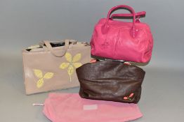 THREE RADLEY HANDBAGS, comprising a pink leather bag with patent handles and contrast stitching, a
