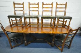 A GOOD REPRODUCTION OAK EXTENDING DINING TABLE, with rounded ends, two additional leaves, on four