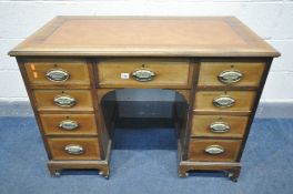 AN EDWARDIAN MAHOGANY, SATINWOOD CROSSBANDED AND STING INLAID KNEE HOLE DESK, with a brown