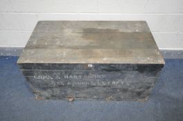 A VINTAGE DISTRESSED MILITARY TRUNK with twin handles, width 112cm x depth 62cm x height 56cm