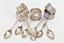 SIX SILVER NAPKIN RINGS AND A QUANTITY OF SILVER TEASPOONS, to include three pierced napkin rings